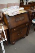 OAK VENEERED BUREAU AND THREE MAHOGANY DINING CHAIRS (4)