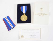 Cased Queen Elizabeth II Golden Jubilee medal, 1952-2002, with extra ribbon and certificate of
