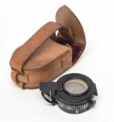 20th century prismatic compass with leather pouch, possibly military, manufactured by Cooke,