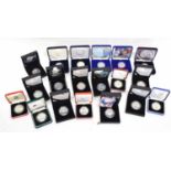 Quantity of 19 various cased silver proof £5 coins