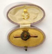 Gold metal Duke of Lancaster's Own Regimental brooch with enamelling to rose laurels and rim