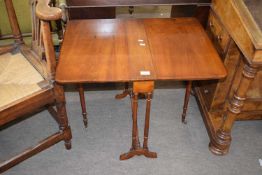 Late 19th century American walnut Sutherland style drop leaf dining table raised on turned legs,