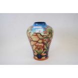A Moorcroft vase designed by Philip Gibson with the Indian Paintbrush pattern22cm highGood