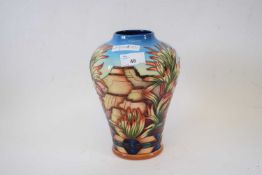 A Moorcroft vase designed by Philip Gibson with the Indian Paintbrush pattern22cm highGood