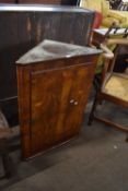 18th century walnut veneered corner cabinet with single door opening to a shelved interior, 63cm