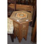 A Syrian hexagonal occasional table with intricate wood and mother of pearl inlay and geometric