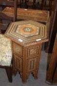 A Syrian hexagonal occasional table with intricate wood and mother of pearl inlay and geometric