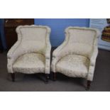 Pair of late Victorian floral upholstered armchairs with front turned legs, 85cm high