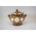 Continental pottery jar and cover, the light buff ground with white slip decoration of flowers, 17cm