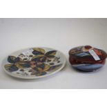 Moorcroft box and cover with tube lined decoration together with a further Moorcroft plate with