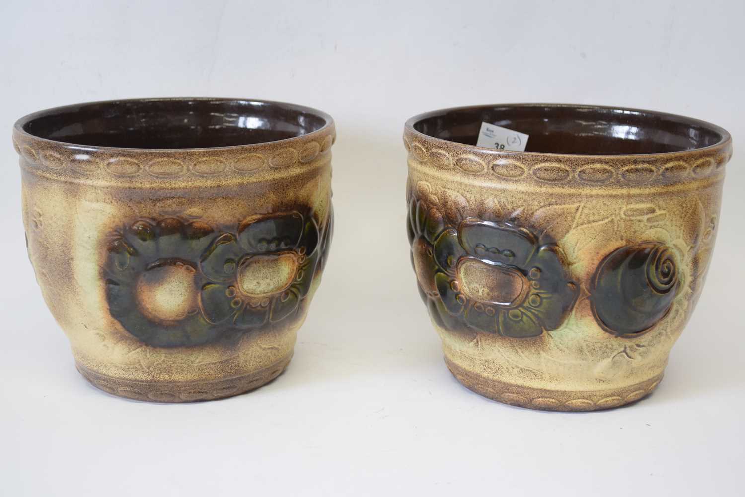 Pair of West German pottery jardinieres with brown glazed decoration in relief, 21cm diam (2)