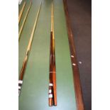 The Embassy Powerglide cue and a Mannock de luxe cue, largest 148cm long (2)