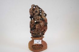 Carved soapstone figure of a Chinese immortal on lobed reticulated base, 24cm high