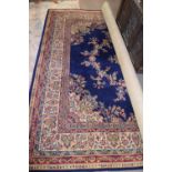 Large 20th century Grosvenor Kemnor Wilton floor rug, decorated with a floral and geometric design