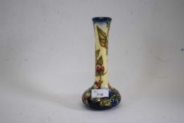 A modern Moorcroft vase with typical tube lined floral decoration21cm highGood condition