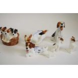 A group of Royal Doulton terrier models including seated dog HN1099, dog lying on its back HN1101,