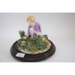 Crown Staffordshire model of a young girl amongst flowers by T Bayley