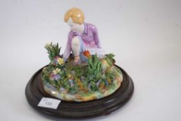 Crown Staffordshire model of a young girl amongst flowers by T Bayley