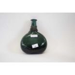 A late 18th/19th century Persian green glass saddle flask of compressed ovoid form with tapered neck