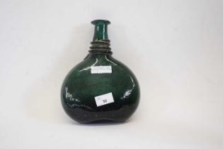 A late 18th/19th century Persian green glass saddle flask of compressed ovoid form with tapered neck