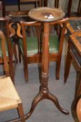 Late 19th/early 20th century mahogany torchere plant stand raised on tripod base, 108cm high