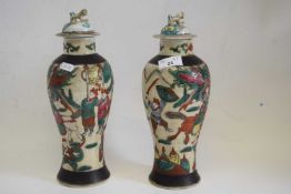 Two Chinese porcelain crackle ware vases and covers, both with famille vert decoration of