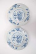 A pair of 18th century Delft plates, probably Lambeth with a blue and white floral design to the