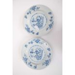 A pair of 18th century Delft plates, probably Lambeth with a blue and white floral design to the