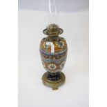 Lambeth Doulton oil lamp with glass chimney (crack to top), the lamp 32cm high