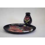 Oval Moorcroft dish with tube lined anemone type design, together with small Moorcroft baluster vase