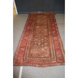 Early 20th century Middle Eastern wool floor rug decorated with central panel of small geometric