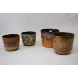 Group of four West German pottery plant holders, all with typical mottled designs, largest 17cm diam