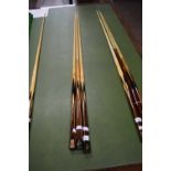 Three Powerglide cues marked Connoisseur, with facsimile signature for Rex Williams, 147cm long