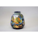 A modern Moorcroft vase with tube lined decoration in the Martinique pattern15cm highGood condition