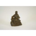 Metal figure of a Chinese deity reading a scroll, 13cm high