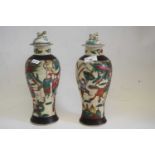 Two Chinese porcelain crackle ware vases and covers, both with famille vert decoration of