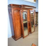 Victorian mahogany break front wardrobe with moulded cornice over two central mirrored doors and two