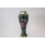 A Moorcroft vase with tube lined decoration in the Rain Forest pattern29cmGood condition