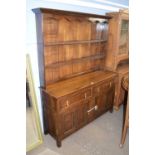 18th century style oak dresser with two shelves back over a base with two drawers and two panelled