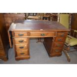 Late Victorian American walnut twin pedestal desk with nine drawers and a drop leaf extension to one