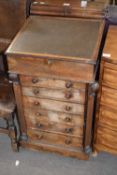 Victorian rosewood veneered Davenport desk with float top opening to an interior with pigeonholes