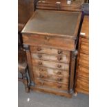 Victorian rosewood veneered Davenport desk with float top opening to an interior with pigeonholes