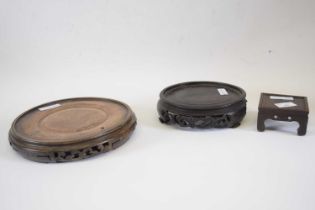 Group of vintage Chinese wooden circular and one rectangular carved stands (3)