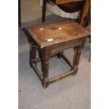 Antique oak joint stool of typical form raised on turned legs with ribbed decoration to sides,