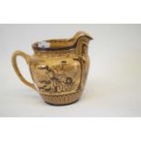 Early 20th century Royal Doulton brown glazed series ware jug featuring the Eglington Tournament,