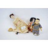 Doll with composite body and two small Chinese dolls