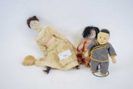 Doll with composite body and two small Chinese dolls