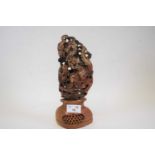 Carved soapstone figure of a Chinese immortal on lobed reticulated base, 24cm high