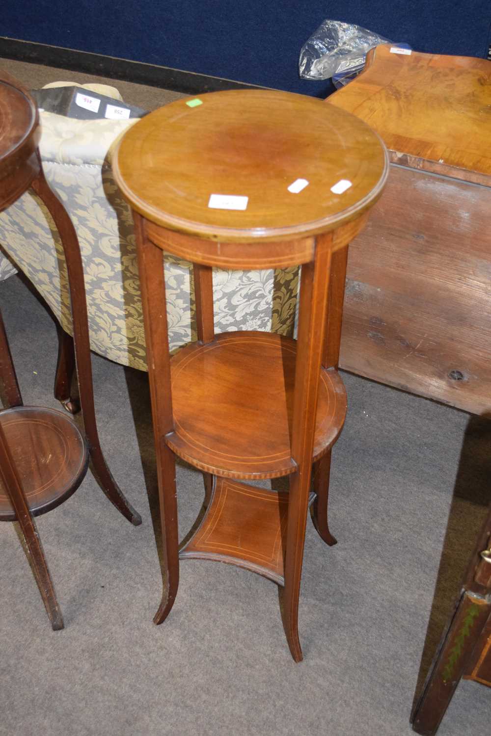 Edwardian mahogany and inlaid circular three tier plant stand raised on outswept legs, 94cm high