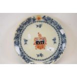 Oriental porcelain armorial dish with armorial to the centre within blue decorated borders, probably